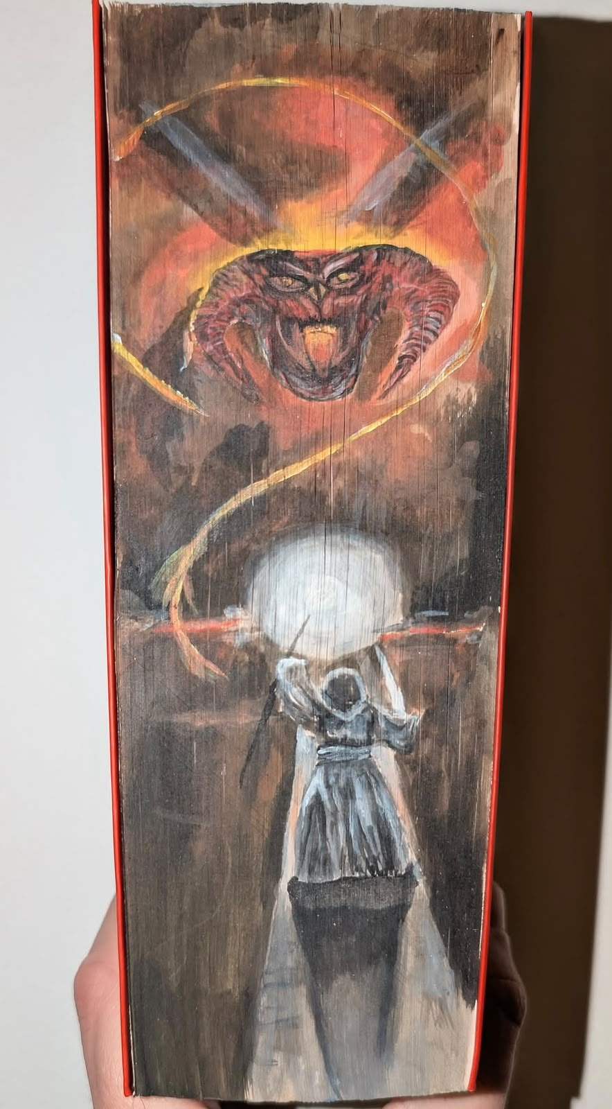Tall fore-edge painting of Gandalf in grey, staff raised in a burst of white light, facing the fiery Balrog on the Bridge of Khazad-dûm.